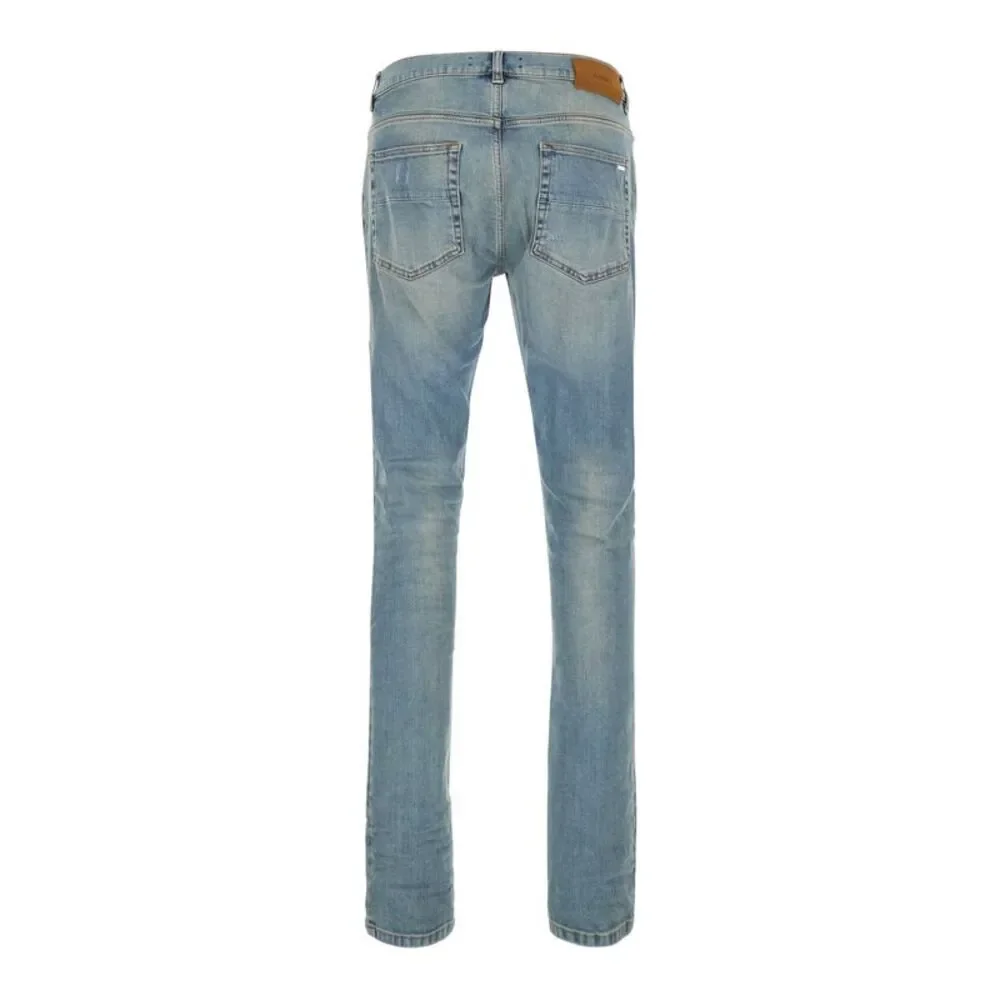 Amiri Men Light Blue Jeans With Ripped Details And Faded Design In Denim For Men
